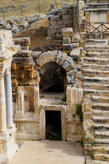 Side entrance to the stage of the amphitheater. Ancient antique amphitheater in city of Hierapolis in Turkey.