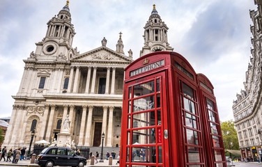 Fototapeta na wymiar Red Telephone booth near St Pauls Cathedral in London