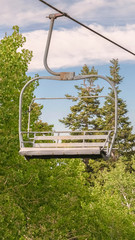 Vertical frame Empty chairlifts in Park City Utah ski resort on a sunny summer day