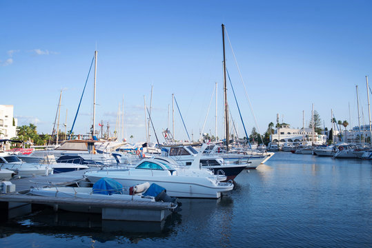 Many yachts moored on the seashore. Luxury sailboat