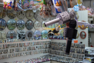 Karaoke microphone close-up. It also has speaker audio output. It was taken in front of the store.