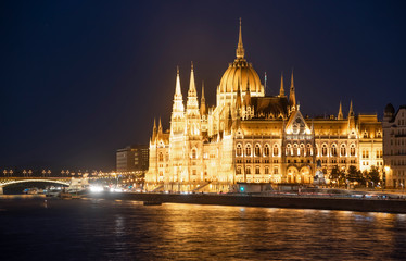 Fototapeta na wymiar The Hungarian Parliament building along the Danube River at night