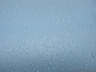 Pattern of water droplets on a plastic pool.