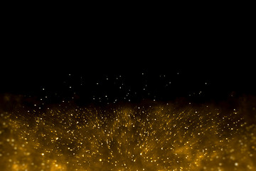 Abstract gold spark particle fireworks background