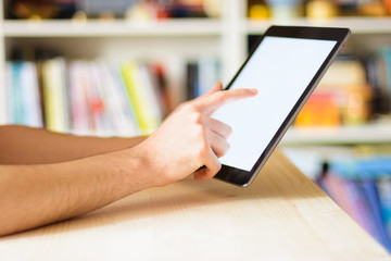 Close up hands multitasking man using tablet
