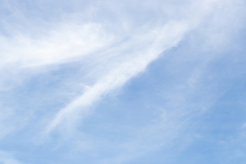 Clear blue sky with white cloud background
