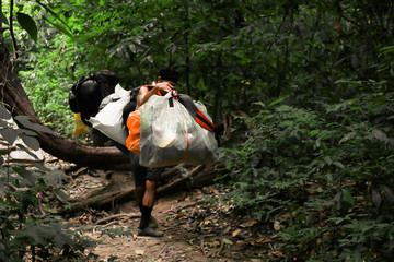 Sukhothai/Thailand - 31 October 2019:Mountain porter on Khao Luang mountain in Ramkhamhaeng National Park,Sukhothai province Thailand