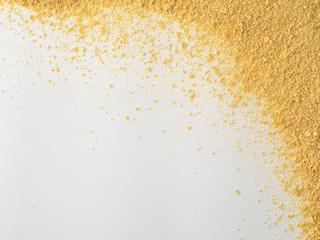 Nutritional yeast on white background. Nutritional inactive yeast top view. Copy space. Nutritional...