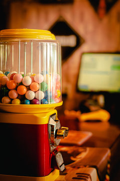 Bubble gum balls ( Bolas de chiclete ). A retro machine from bubble gum balls in a restaurant with warm colors.