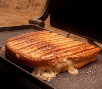 Photo of a grilled hot cheese sandwich. Typical brazilian snack.