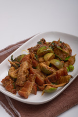 Stir fried crispy fork with red curry.