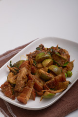 Stir fried crispy fork with red curry.