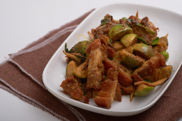 Stir fried crispy fork with red curry.
