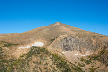 arren landscape with snow fields above 12,000 feet in Rocky Mountain National Park
