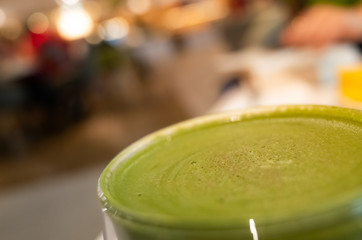 cup of matcha milk tea on table