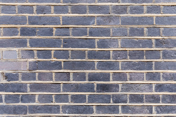 Abstract weathered stained background of brick wall texture, grungy rusty architecture wallpaper