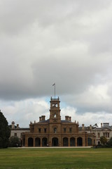 Fototapeta na wymiar details of the old world architecture on the grand mansion viewed through the gardens at Werribee mansion, an old large Australian property near Melbourne Victoria, Australia