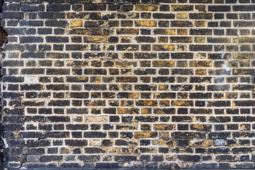 Abstract weathered stained background of brick wall texture, grungy rusty architecture wallpaper