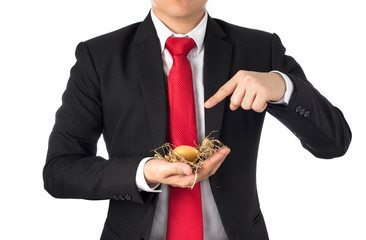 business man invest in gold egg , concept risk investment in trading asset	