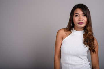 Portrait of Asian woman with wavy hair