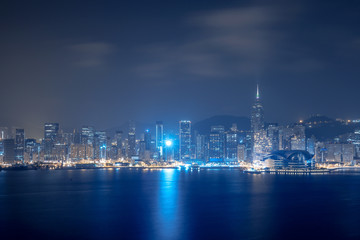 Naklejka premium Cityscape and skyline at Victoria Harbour in Hong Kong city at Night