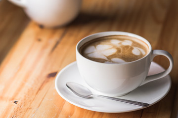 cup of coffee on wooden table