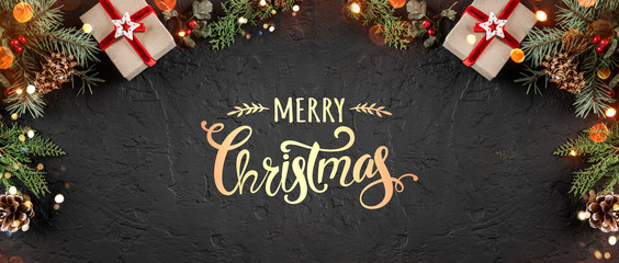 Christmas gift boxes on holiday background with Fir branches, pine cones. Xmas and Happy New Year...