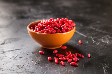 Barberry in bowl, selective focus, copy space