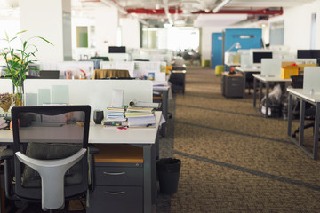 Modern office interior with tables, chairs and bookcases. Nobody