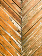 shabby wooden wall with cracked paint. worn hardwood boards 