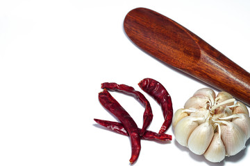 dried chilli and garlic on a white background	