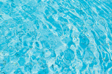 Water surface in blue swimming pool