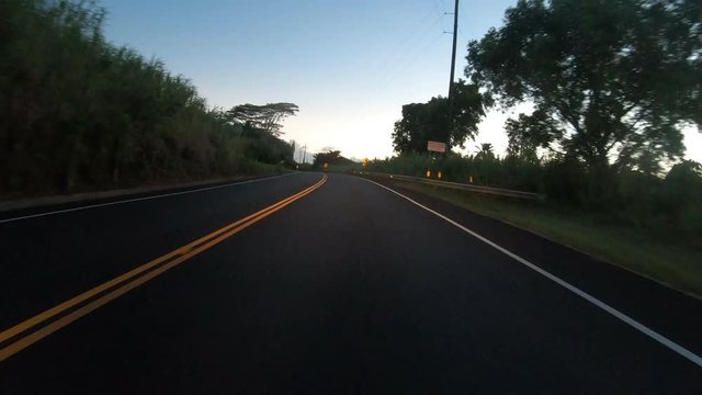 Driving Down Rural Hawaiian Road At Dusk