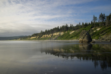 Beach at dusk reflected in sand