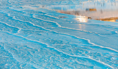 Beautiful landscape cracking ice, frozen norwegian sea coast at sunrise - Tromso, Norway