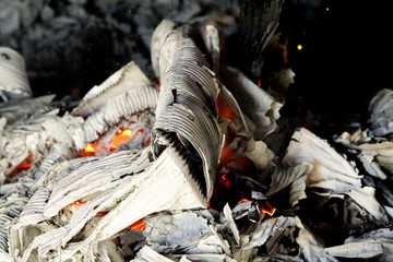 Obraz premium Ashes, coals and fire in the stove