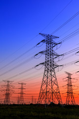 Fototapeta premium High voltage electricity tower sky sunset landscape,industrial background.