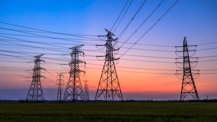 High voltage electricity tower sky sunset landscape,industrial background.