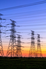 High voltage electricity tower sky sunset landscape,industrial background.