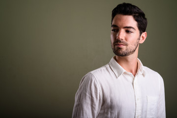 Obraz premium Portrait of young handsome businessman with stubble beard