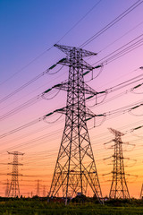 Fototapeta premium High voltage electricity tower sky sunset landscape,industrial background.