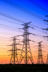 Fototapeta premium High voltage electricity tower sky sunset landscape,industrial background.