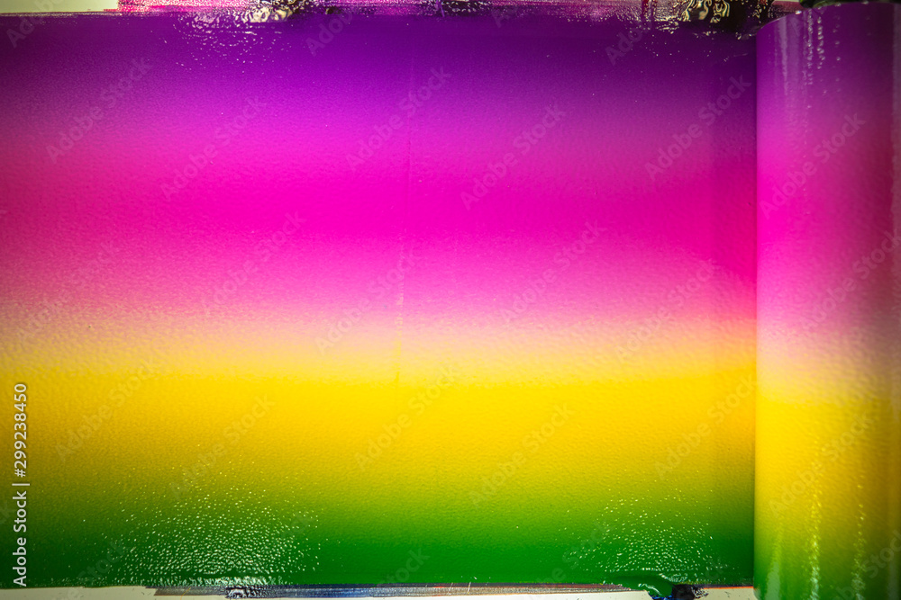 Poster the combination of the colors of printing ink so that the colors slide together using a roller on th