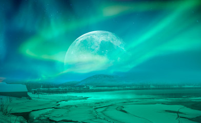 Northern lights (Aurora borealis) in the sky over Tromso with full moon, Norway "Elements of this image furnished by NASA "