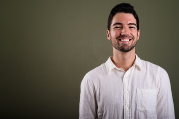 Fototapeta premium Portrait of young handsome businessman with stubble beard