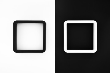 black and white frames on white and black color background, copy space, contrast and opposite concept