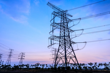 Fototapeta na wymiar High voltage electricity tower sky sunset landscape,industrial background.