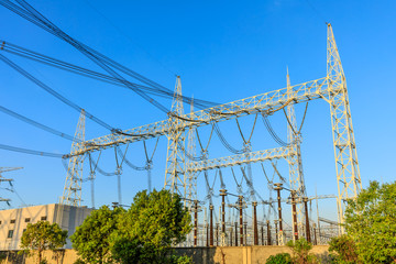 Fototapeta premium High voltage electricity tower at sunset.substation industrial background.