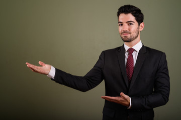 Portrait of young handsome businessman in suit