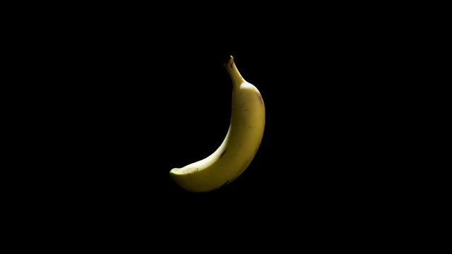 Banana Spinning In Mid Air With Black Background